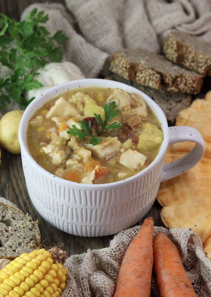 Chicken of the woods soup in a cozy bowl, served with fresh bread.
